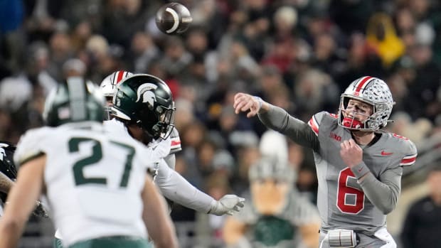Ohio State quarterback Kyle McCord throws a pass at Ohio State against Michigan State. 